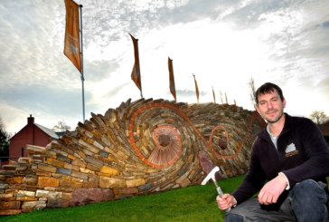 Stone sculpture welcomes visitors to new development