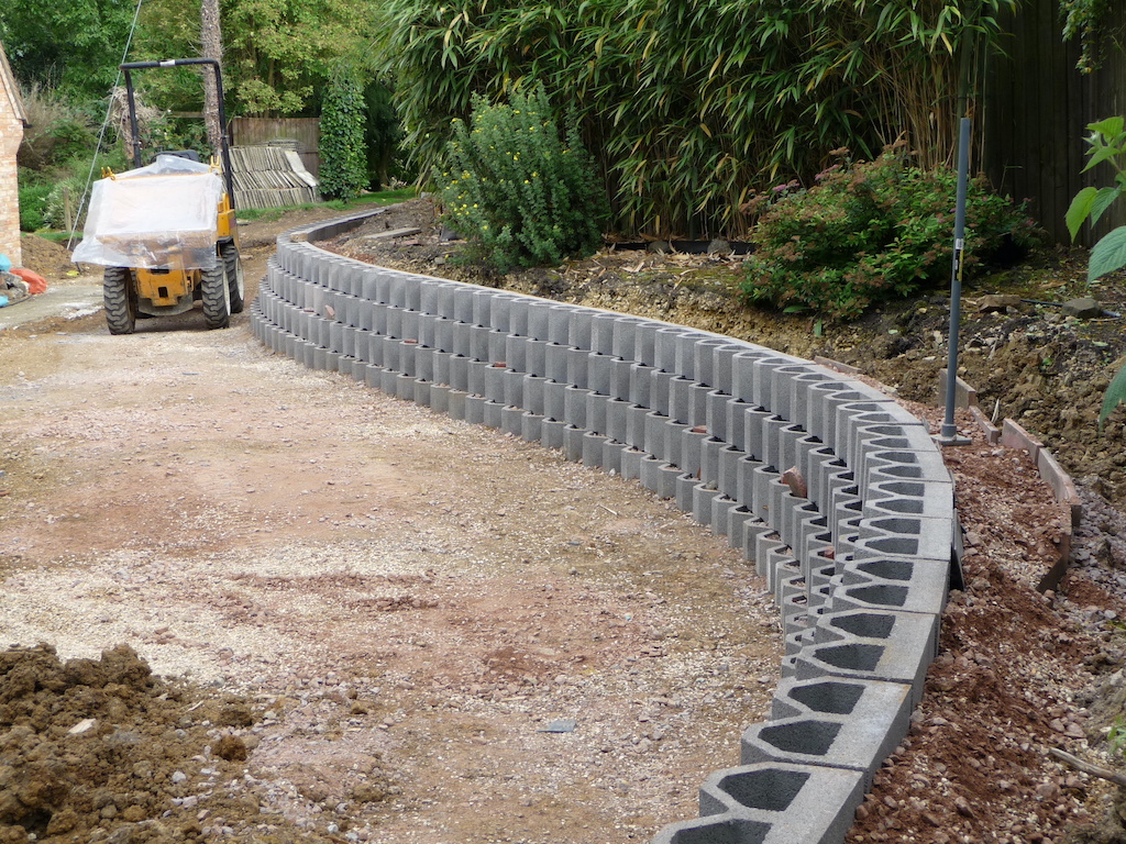 Interlocking concrete blocks for garden store retaining walls