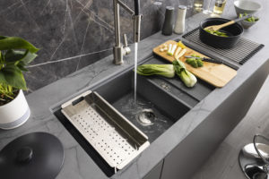 Synchronist collection of granite sinks from Abode is supplied in large or compact bowl sizes in matt white, metallic black/grey finishes.